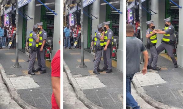PM aponta a arma para o rosto do colega da corpora&ccedil;&atilde;o, que reage. Caso ocorreu no Centro de S&atilde;o Paulo e foi gravado por pedestres; imagens circulam nas redes sociais.(Imagem:Reprodu&ccedil;&atilde;o/ Redes sociais)